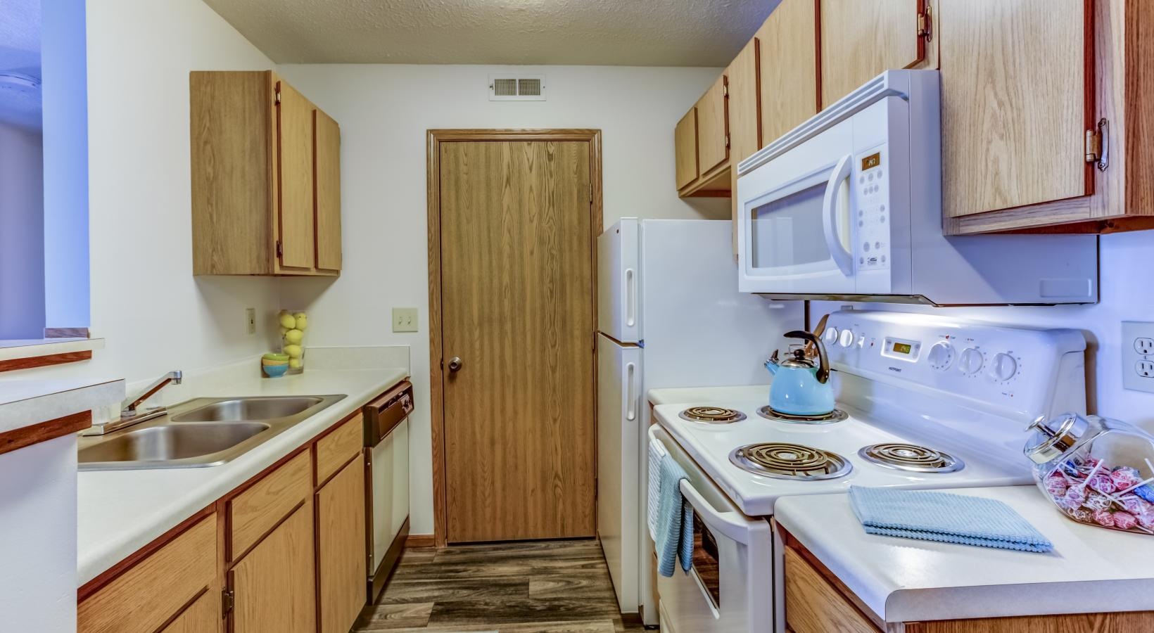 Spacious kitchens with thoughtful details a kitchen with white appliances