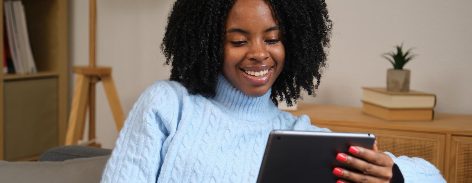 a woman holding a tablet