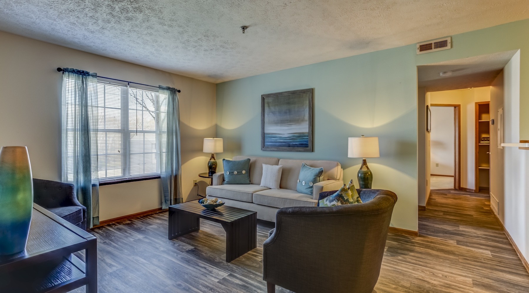 a living room with a couch and coffee table