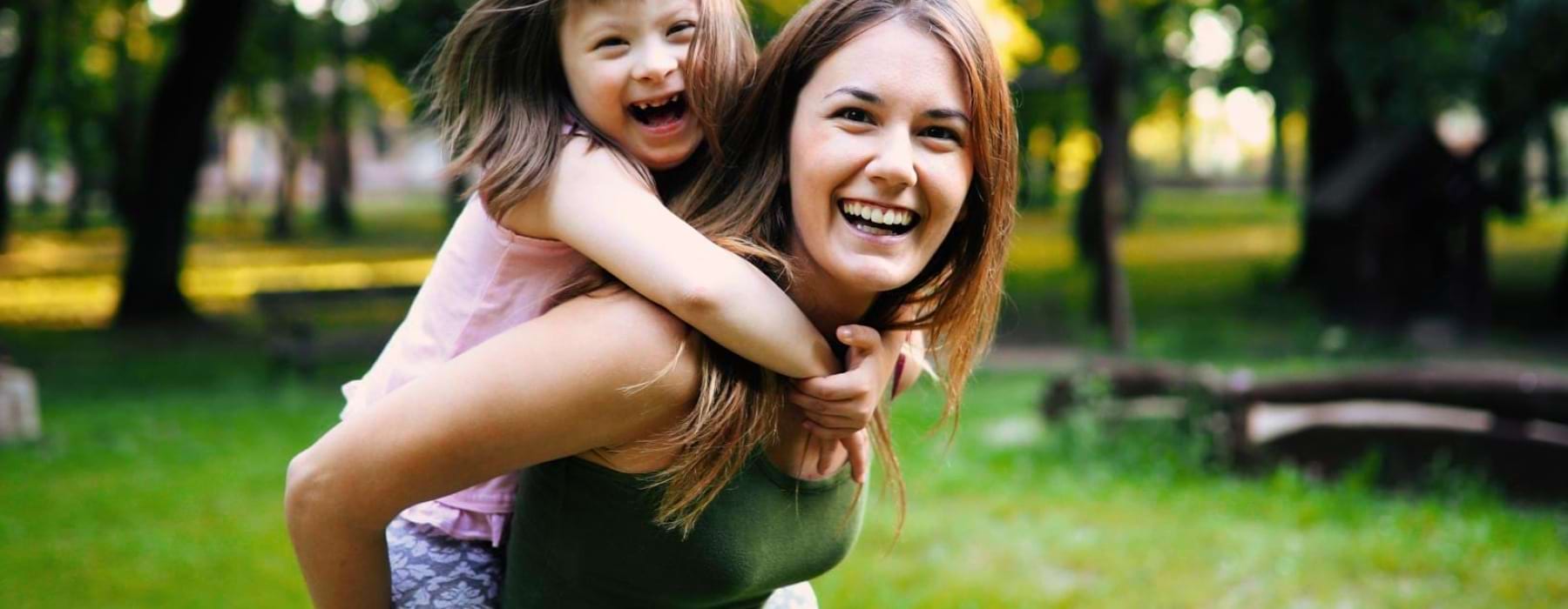 a woman holding a child