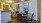 a kitchen with a table and chairs