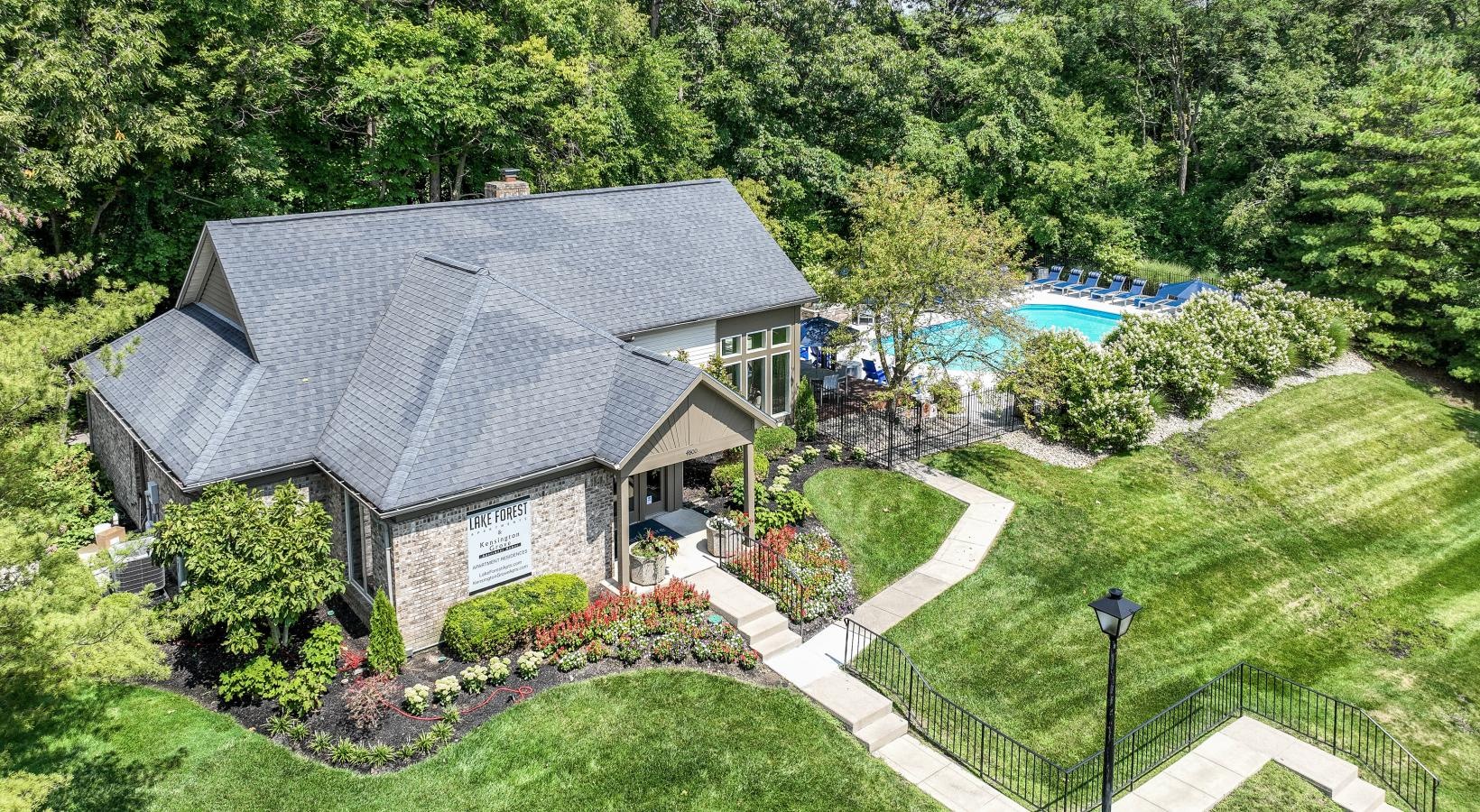 The essence of exceptional living a house with a pool and trees around it