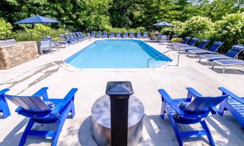 a pool with chairs around it