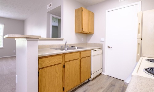 a kitchen with wooden cabinets