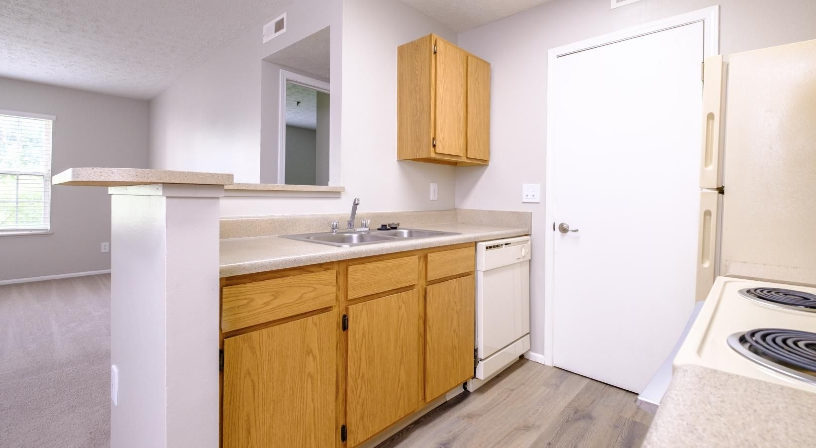 Spacious kitchens with thoughtful details a kitchen with wooden cabinets