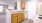 a kitchen with wooden cabinets