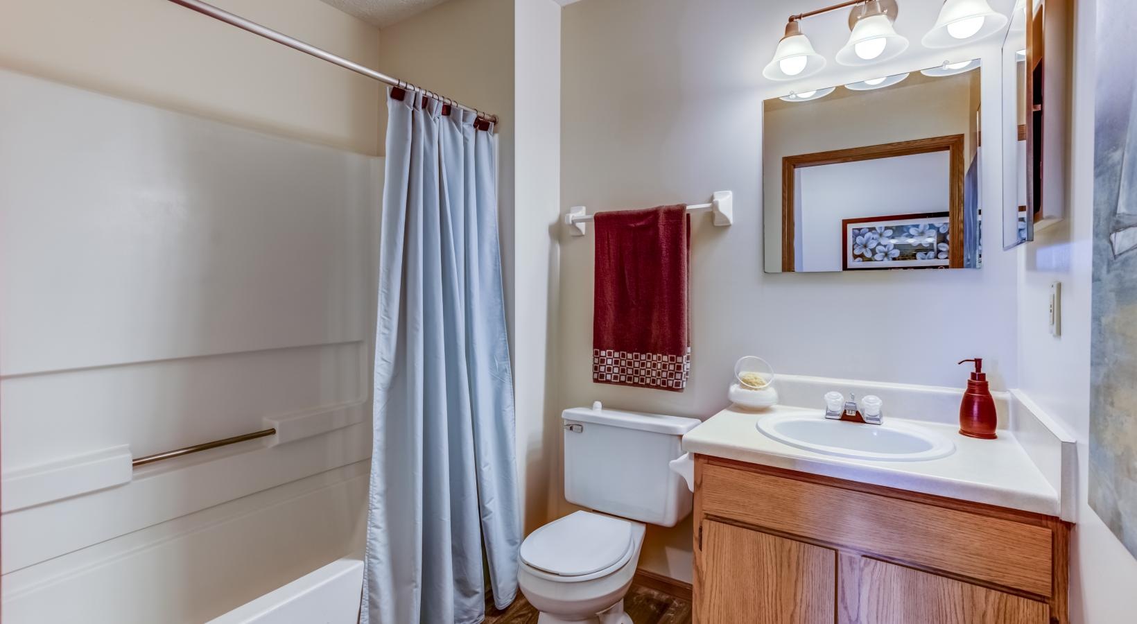 Spacious bathrooms with everything you need a bathroom with a sink toilet and bathtub