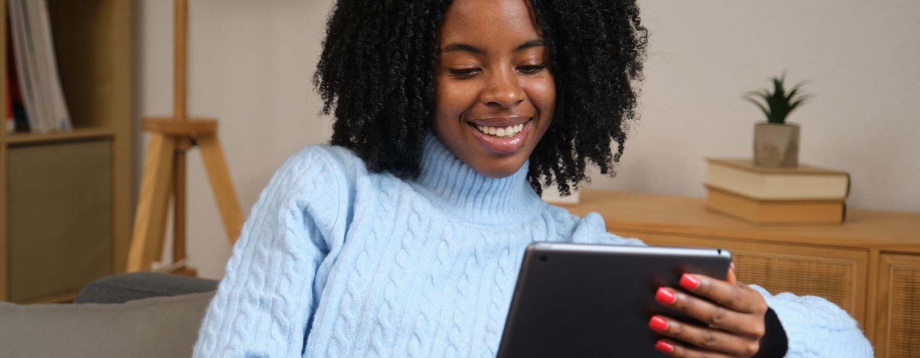 a woman holding a tablet
