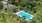 a swimming pool surrounded by trees