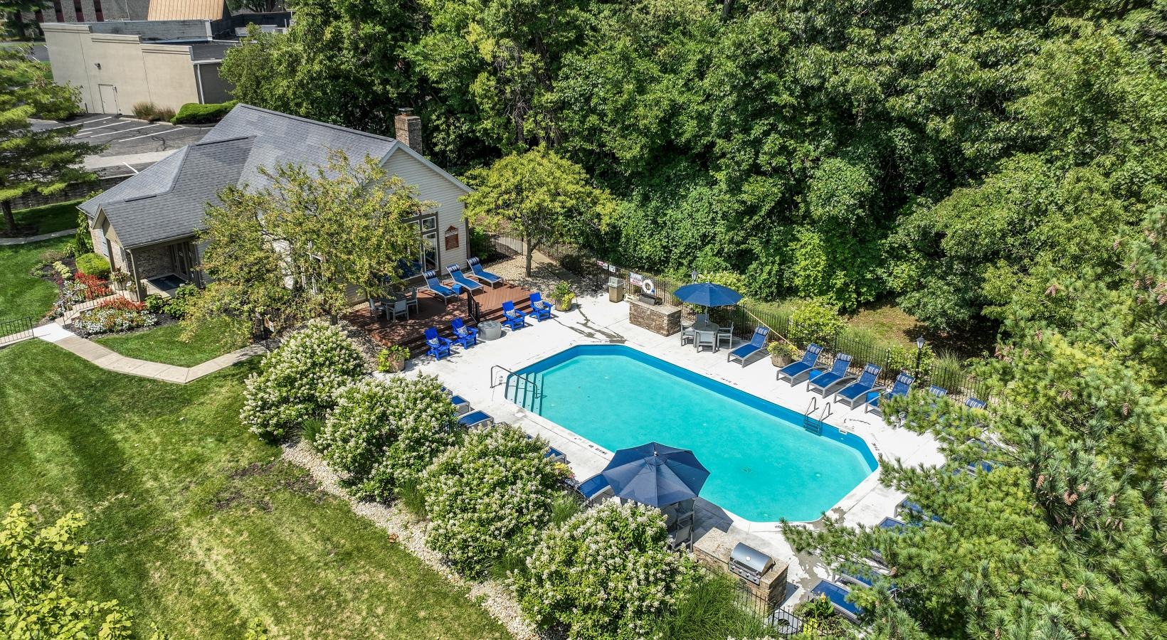 Settle into comfort at Lake Forest a swimming pool surrounded by trees